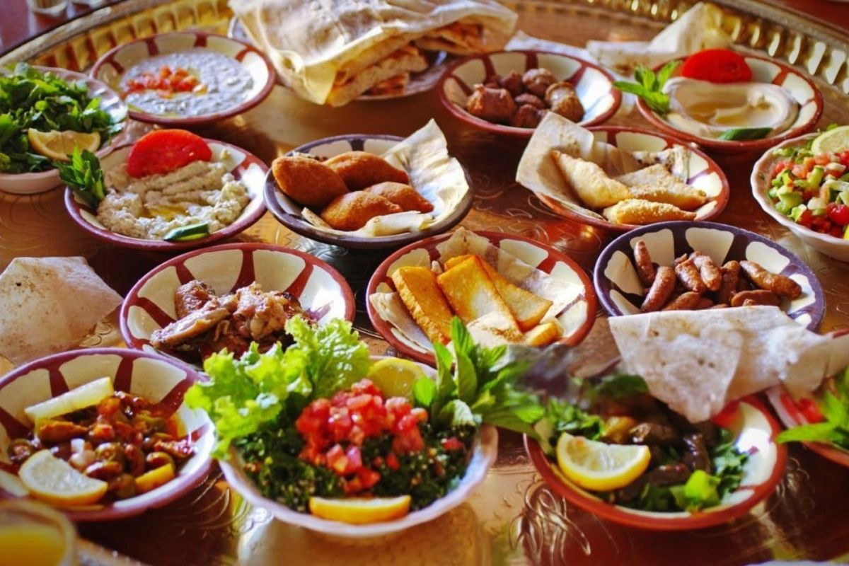 Authentic Egyptian street food including falafel sandwiches fresh vegetables and traditional flavors served on a table