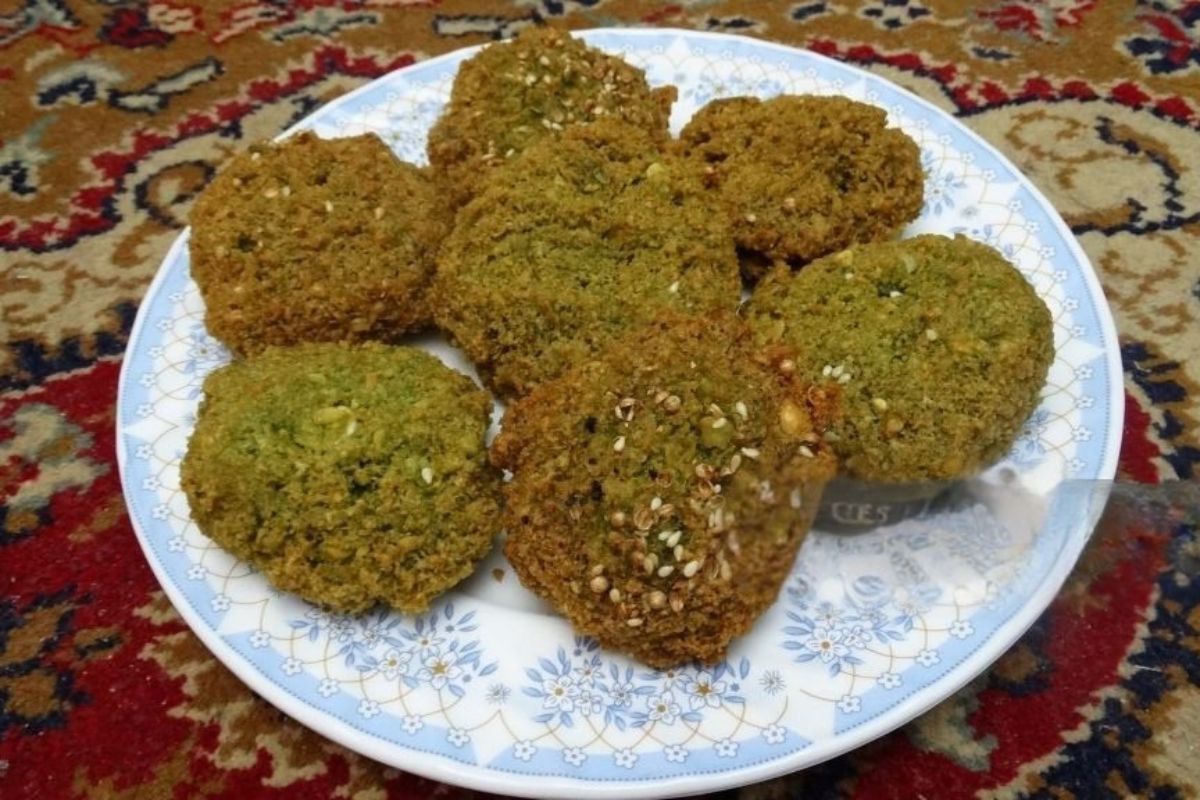 Egyptian Taameya falafel made from fava beans served with fresh vegetables and bread